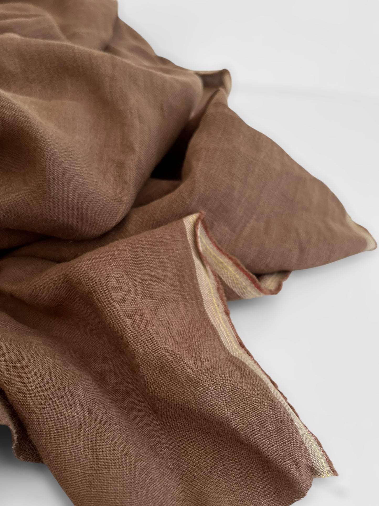 Brown linen fabric on a white background