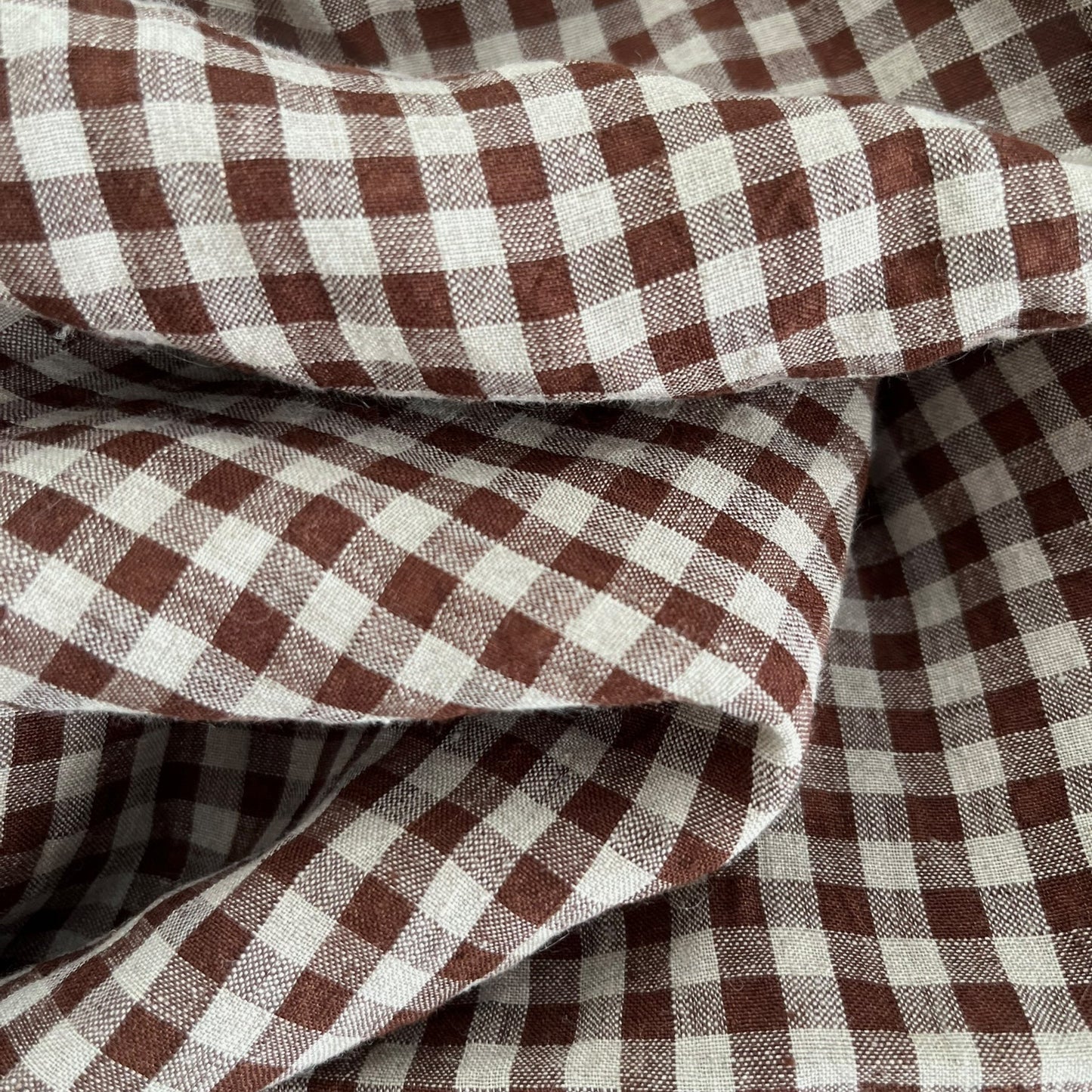 Close-up of brown and natural gingham fabric
