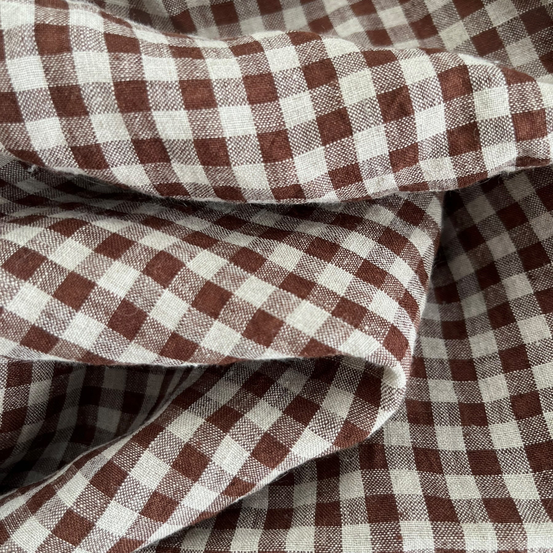 Close-up of brown and natural gingham fabric