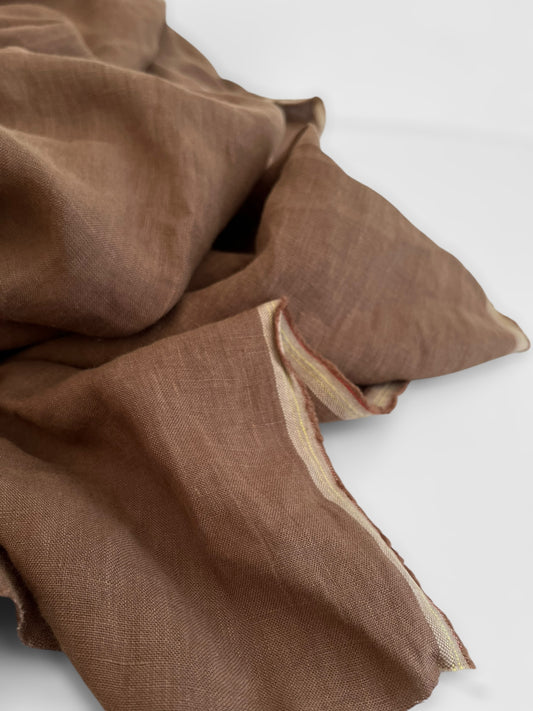 Brown linen fabric on a white background