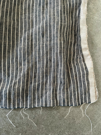 Striped fabric on a concrete surface