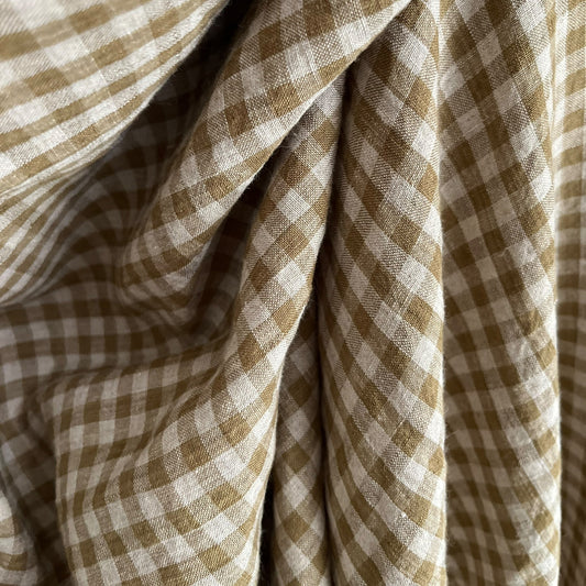 Close-up of olive green and natural flax checkered fabric
