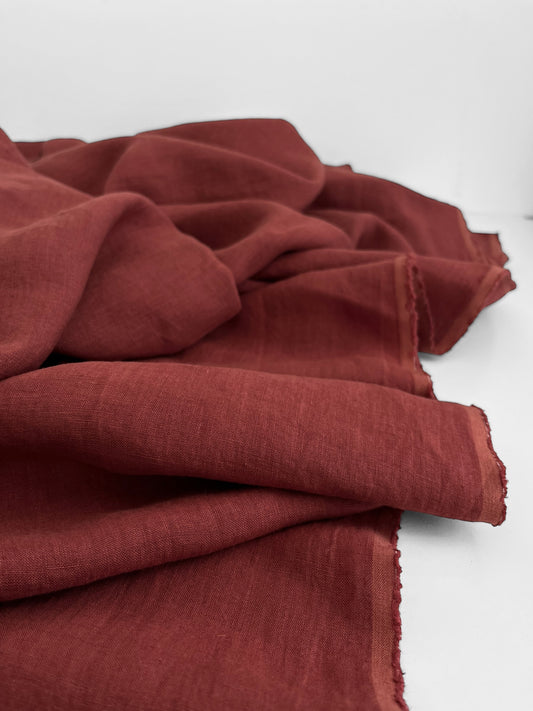 Folded red fabric on a white background